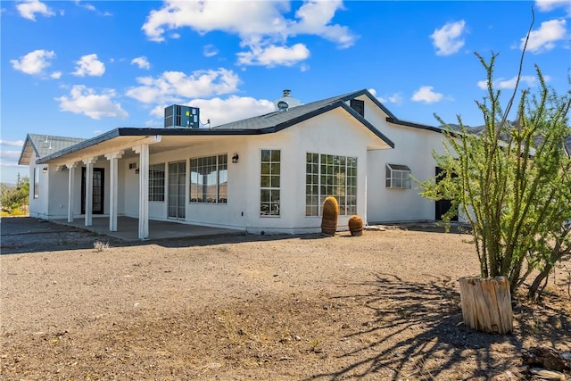 15565 Iron Dr, Dolan Springs, AZ 86441 - rear view of property featuring stucco siding and a porch