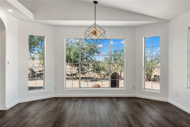 15565 Iron Dr, Dolan Springs, AZ 86441 - unfurnished dining area featuring dark wood-type flooring, arched walkways, lofted ceiling, and recessed lighting