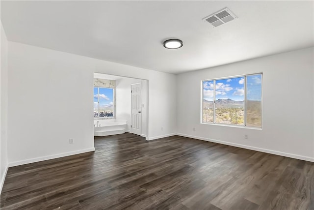 15565 Iron Dr, Dolan Springs, AZ 86441 - spare room with dark wood finished floors