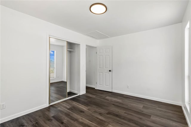 15565 Iron Dr, Dolan Springs, AZ 86441 - unfurnished bedroom with dark wood-type flooring and a closet