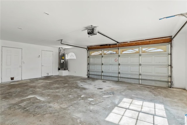 15565 Iron Dr, Dolan Springs, AZ 86441 - garage featuring a garage door opener and electric water heater