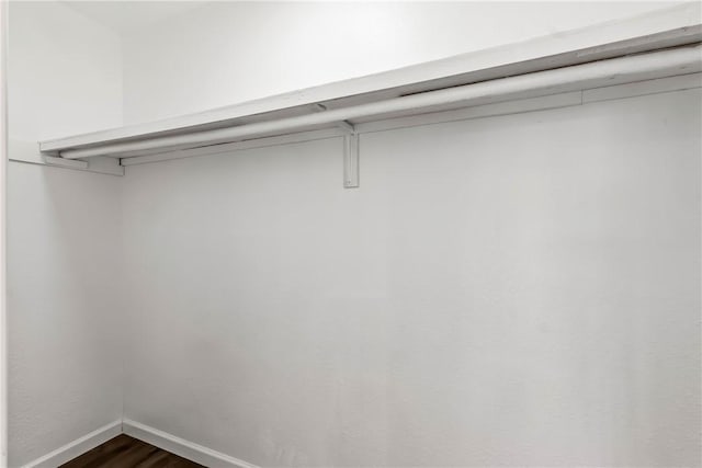 15565 Iron Dr, Dolan Springs, AZ 86441 - spacious closet featuring dark wood-style floors