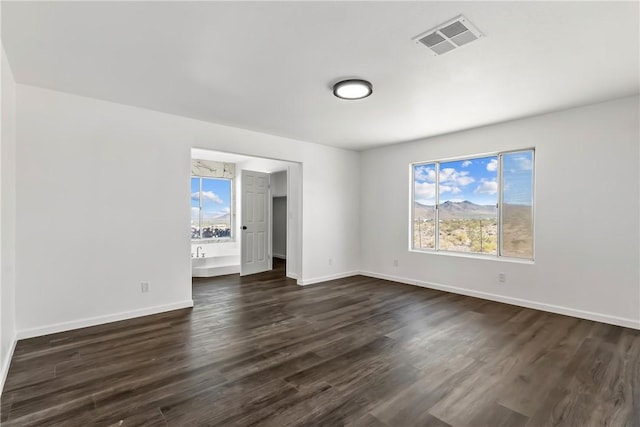 15565 Iron Dr, Dolan Springs, AZ 86441 - unfurnished room featuring dark wood-type flooring