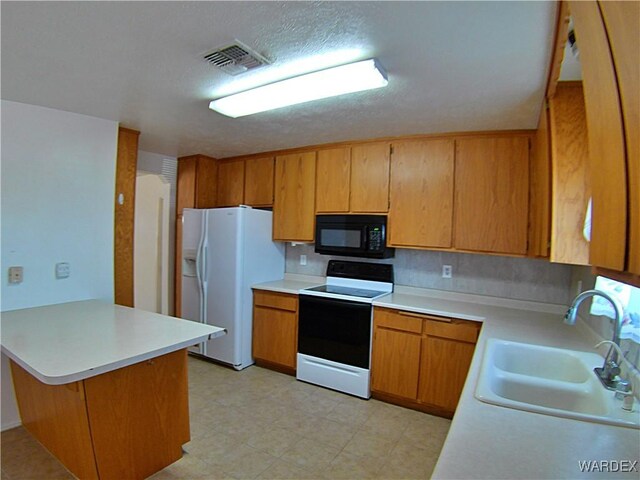 kitchen featuring white fridge with ice dispenser, black microwave, light countertops, and range with electric stovetop