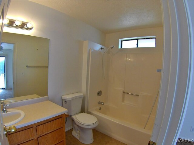 bathroom with toilet, washtub / shower combination, and vanity