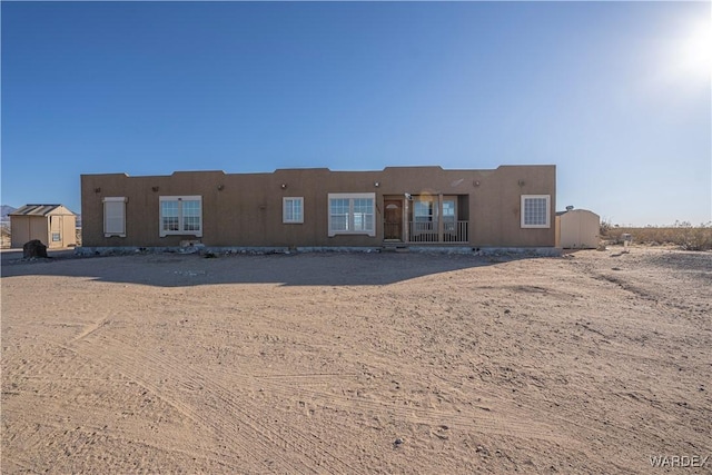 pueblo-style home with stucco siding