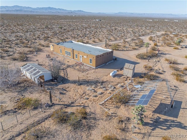 aerial view featuring view of desert and a mountain view