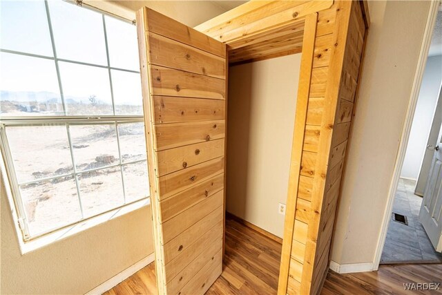 corridor with wood finished floors