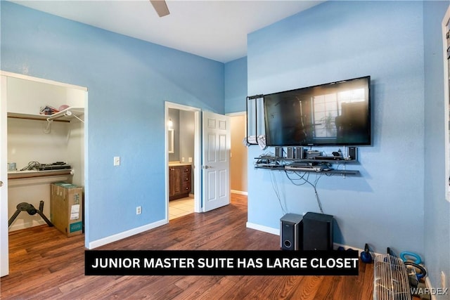 living room featuring baseboards and wood finished floors