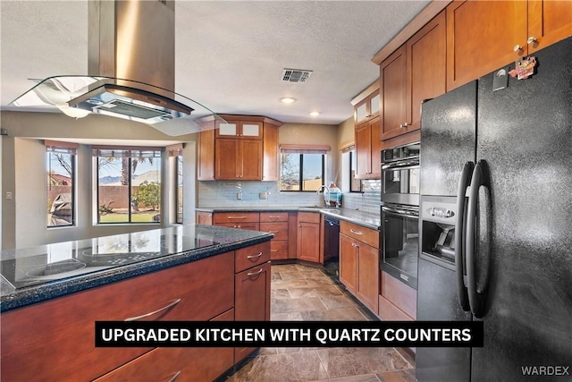 kitchen with visible vents, glass insert cabinets, island exhaust hood, black appliances, and a sink