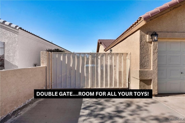 view of gate with fence