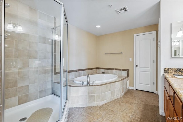 251 Moser Ave Unit 310, Bullhead City, AZ 86429 - bathroom with visible vents, a stall shower, tile patterned flooring, a bath, and vanity