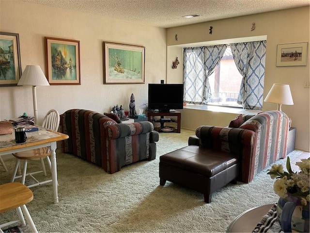 201 Riverfront Drive, Drive, Bullhead City, AZ 86442 - carpeted living area featuring a textured ceiling