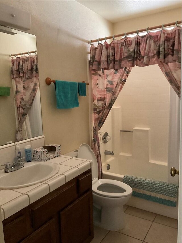 201 Riverfront Drive, Drive, Bullhead City, AZ 86442 - bathroom with toilet, tile patterned flooring, shower / tub combo, and vanity