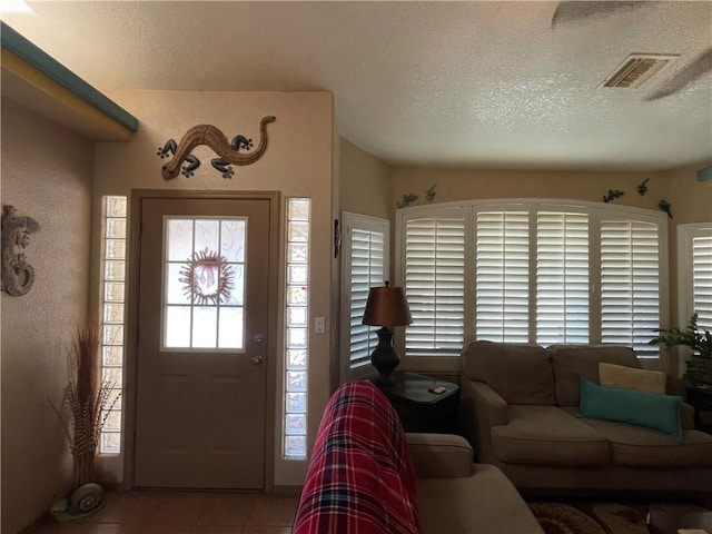 2405 N Clack Canyon Rd, Kingman, AZ 86409 - entryway featuring tile patterned floors and a textured ceiling