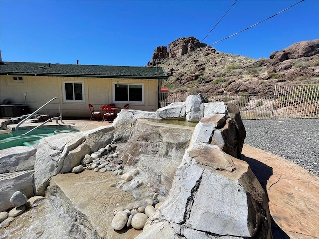 2405 N Clack Canyon Rd, Kingman, AZ 86409 - exterior view of a swimming pool and a mountainous background