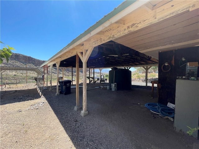 2405 N Clack Canyon Rd, Kingman, AZ 86409 - view of patio / terrace with a mountain view and a carport