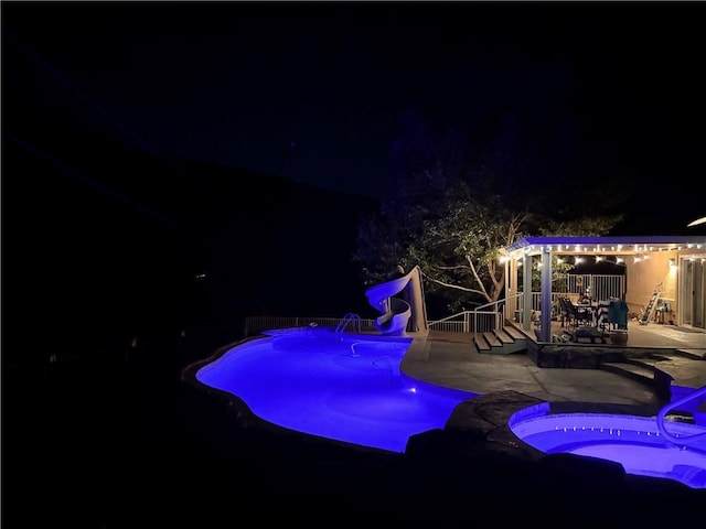 2405 N Clack Canyon Rd, Kingman, AZ 86409 - pool at twilight with a patio area, a water slide, and an outdoor pool