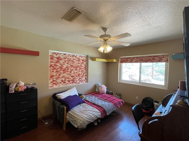 2405 N Clack Canyon Rd, Kingman, AZ 86409 - bedroom with a textured ceiling, wood finished floors, and ceiling fan