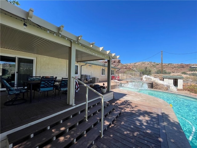 2405 N Clack Canyon Rd, Kingman, AZ 86409 - wooden deck featuring a pool with connected hot tub and a patio