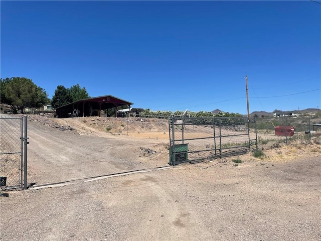 2405 N Clack Canyon Rd, Kingman, AZ 86409 - view of dirt / gravel driveway featuring a gate and a gated entry