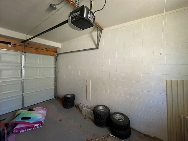2405 N Clack Canyon Rd, Kingman, AZ 86409 - garage featuring a garage door opener and concrete block wall