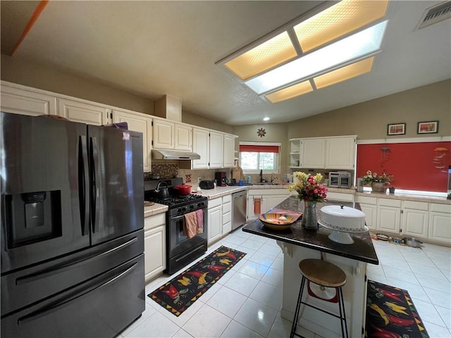 2405 N Clack Canyon Rd, Kingman, AZ 86409 - kitchen with fridge with ice dispenser, gas stove, dishwasher, under cabinet range hood, and white cabinets
