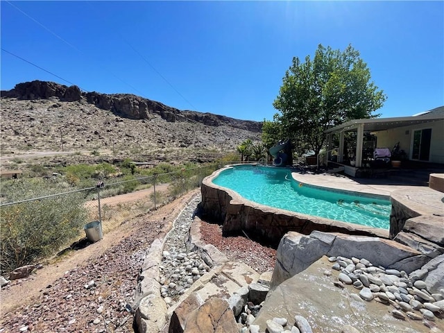 2405 N Clack Canyon Rd, Kingman, AZ 86409 - view of swimming pool featuring a water slide, a patio, and a mountain view