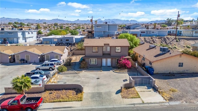 birds eye view of property with a residential view and a mountain view