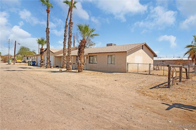 single story home featuring fence and stucco siding