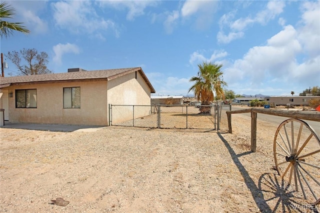 exterior space featuring a gate and fence