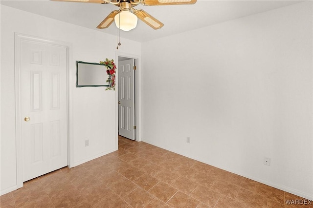 spare room featuring ceiling fan