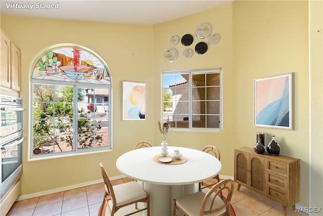 2190 Hijolly Dr, Bullhead City, AZ 86442 - dining area featuring light tile patterned floors and baseboards