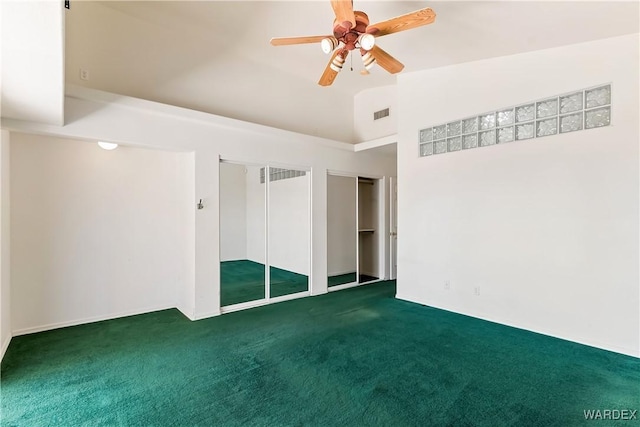 2190 Hijolly Dr, Bullhead City, AZ 86442 - unfurnished bedroom with two closets, visible vents, ceiling fan, high vaulted ceiling, and carpet