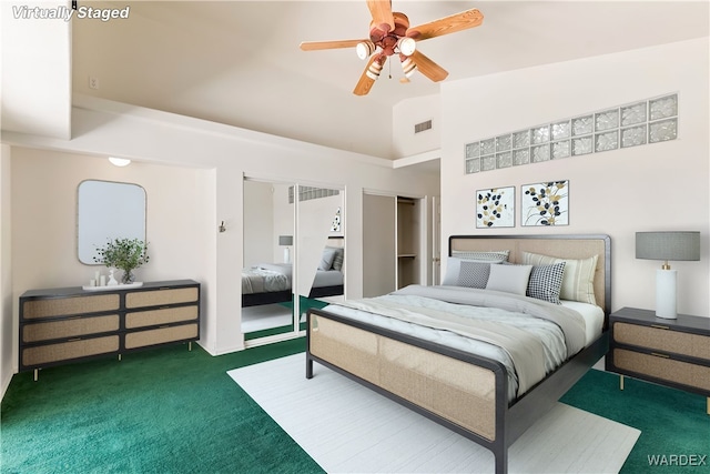 2190 Hijolly Dr, Bullhead City, AZ 86442 - bedroom featuring visible vents, two closets, ceiling fan, carpet floors, and high vaulted ceiling