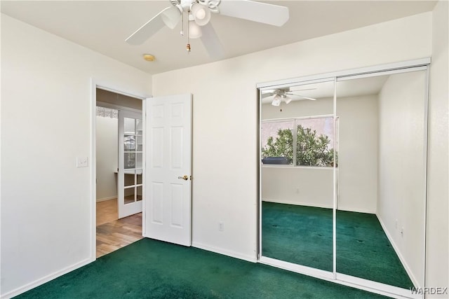 2190 Hijolly Dr, Bullhead City, AZ 86442 - unfurnished bedroom featuring a closet, carpet flooring, ceiling fan, and baseboards