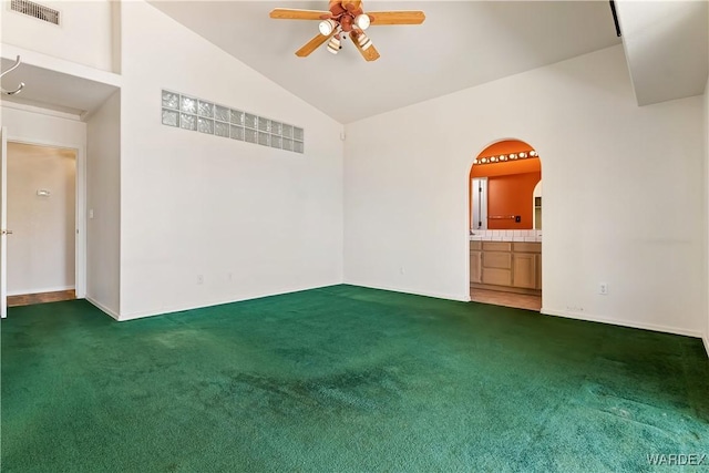 2190 Hijolly Dr, Bullhead City, AZ 86442 - carpeted spare room with visible vents, ceiling fan, arched walkways, and vaulted ceiling