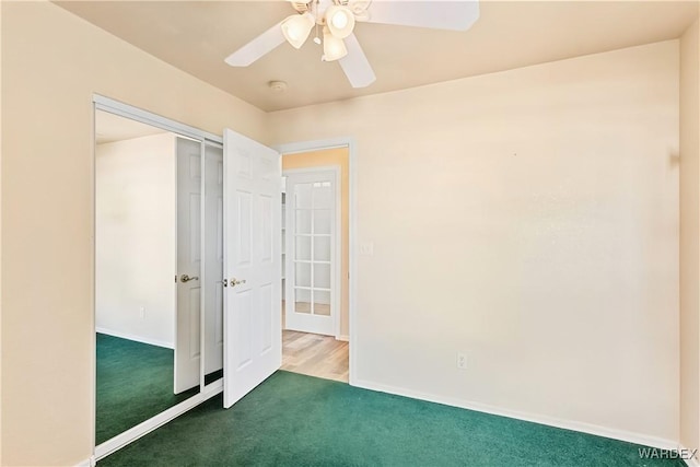 2190 Hijolly Dr, Bullhead City, AZ 86442 - unfurnished bedroom with a closet, ceiling fan, baseboards, and carpet