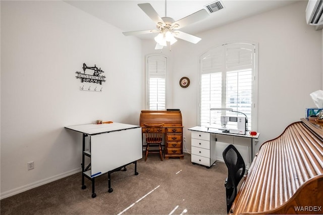 carpeted home office featuring baseboards, visible vents, a ceiling fan, and a wall mounted AC