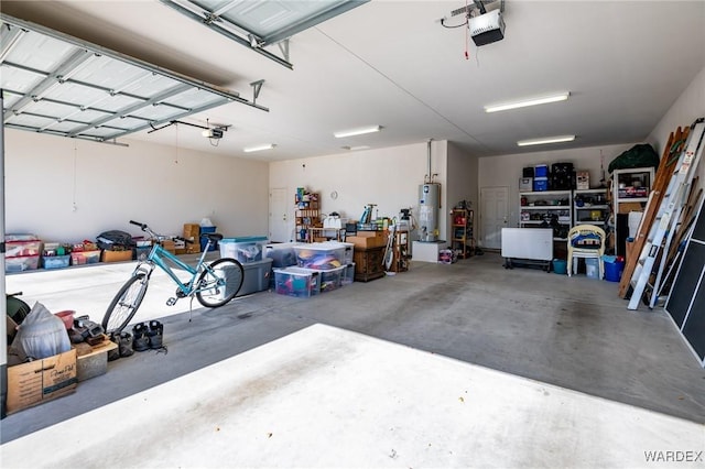 garage featuring a garage door opener and gas water heater