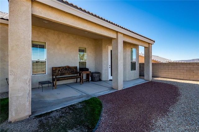 view of patio / terrace featuring fence