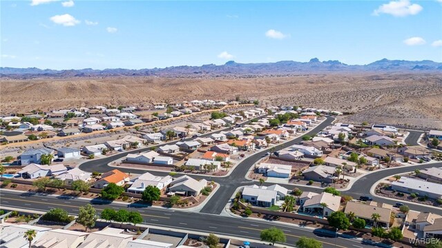 drone / aerial view featuring a residential view and a mountain view