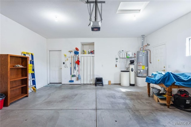 garage featuring secured water heater and a garage door opener