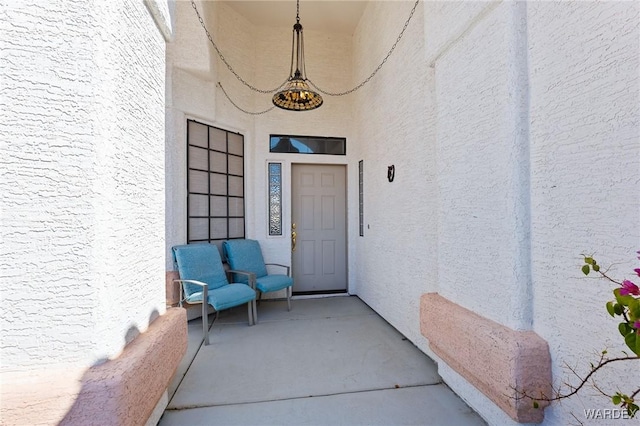 doorway to property with stucco siding