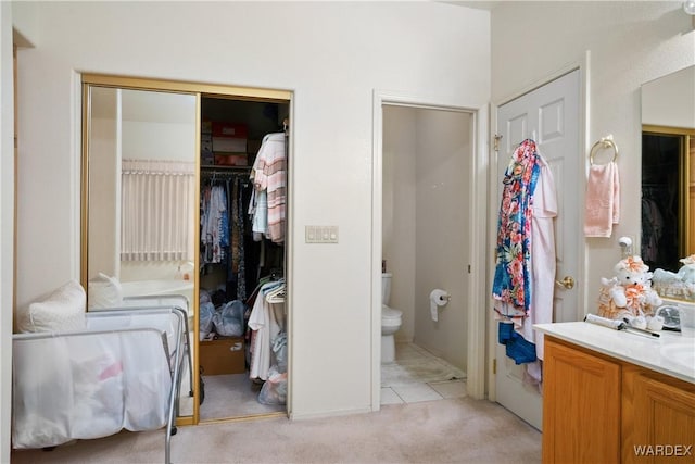 5790 S Gazelle Dr, Fort Mohave, AZ 86426 - bathroom with toilet, vanity, and a walk in closet