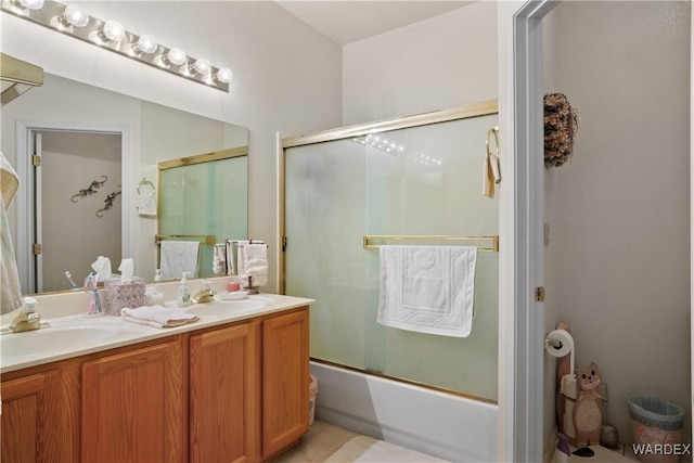 5790 S Gazelle Dr, Fort Mohave, AZ 86426 - bathroom with a sink, double vanity, and combined bath / shower with glass door