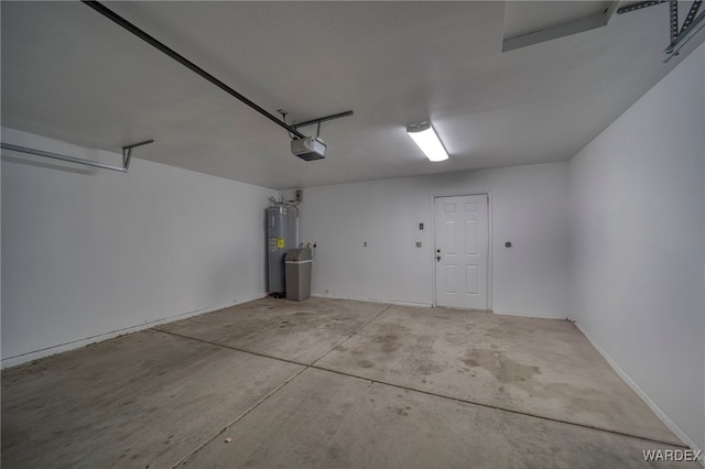 garage featuring a garage door opener and water heater