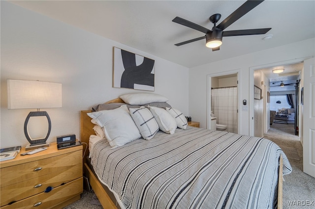 bedroom featuring ensuite bathroom, ceiling fan, and light colored carpet