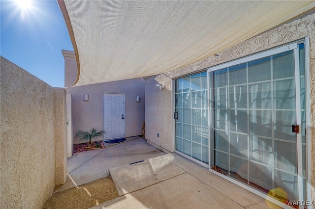 view of patio featuring fence