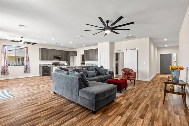 6183 S Lago Grande Dr, Fort Mohave, AZ 86426 - living area featuring ceiling fan, light wood-style flooring, baseboards, and recessed lighting